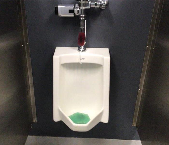 A urinal that leaked sent a lot of water where it shouldn’t be.