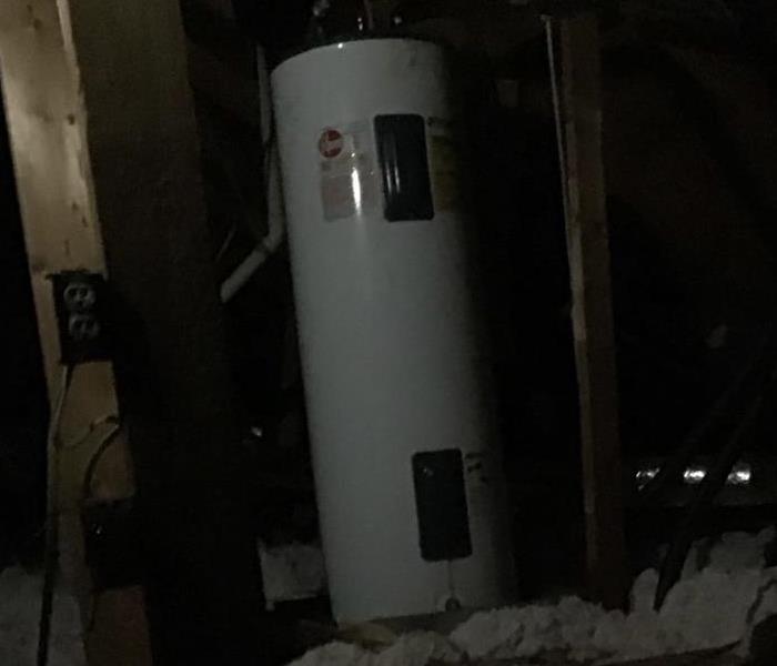 A leaky hot water heater in an attic